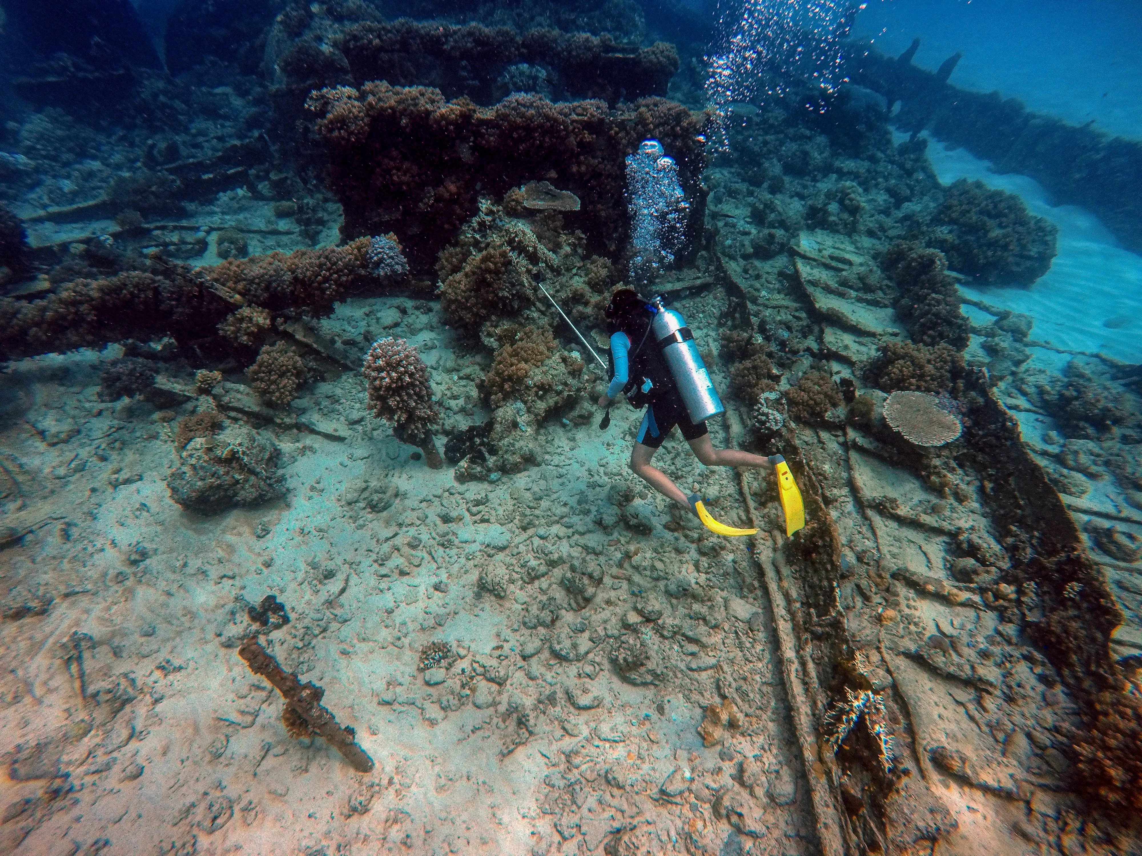 FiveMeters restoration of GoPro shipwreck dive: Sand, timbers and yellow fins regain colour from near seafloor to far hull haze.